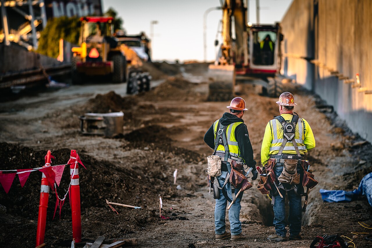 Workers coordinating activity on a construction site
