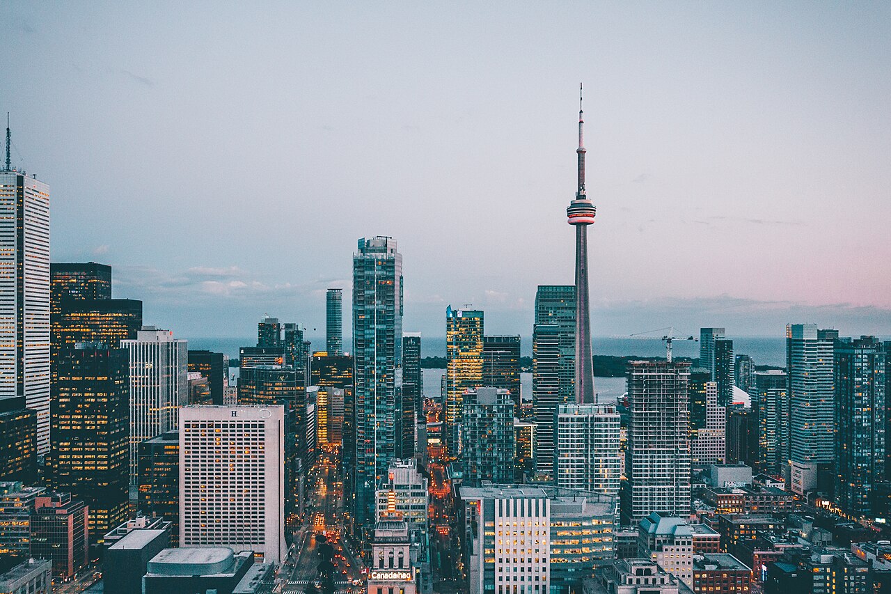 Toronto skyline with commercial towers and residential buildings at dusk
